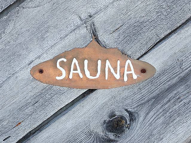 Eine Schild, auf dem Sauna steht